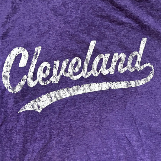 Purple t-shirt with retro 'Cleveland' printed in white on a textured fabric background