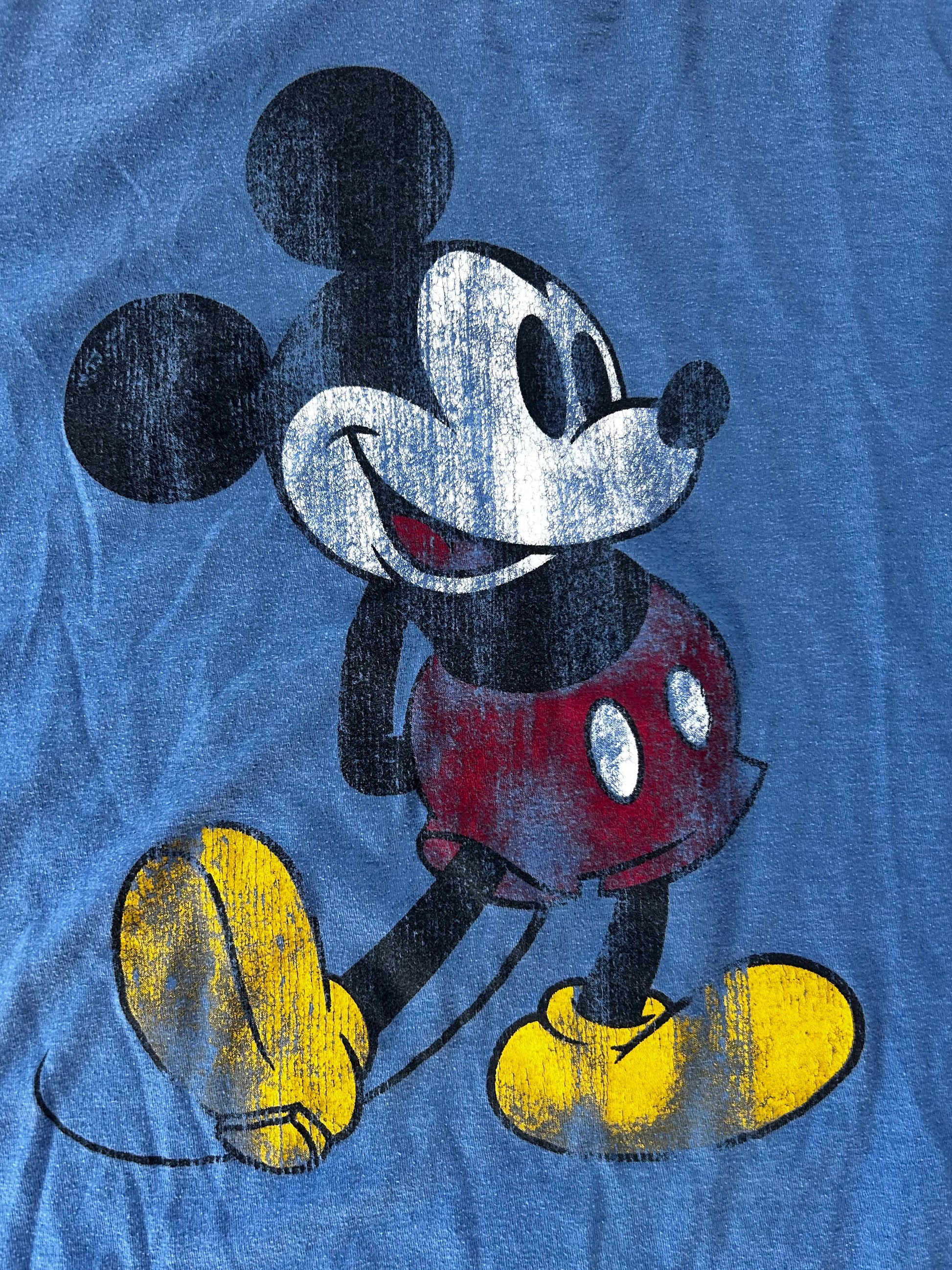 Vintage retro disney mickey mouse illustration of a character on a blue textured background ringer tee