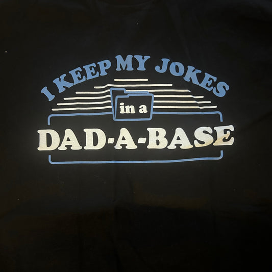 Black t-shirt with a humorous dad joke graphic and text design on a dark background