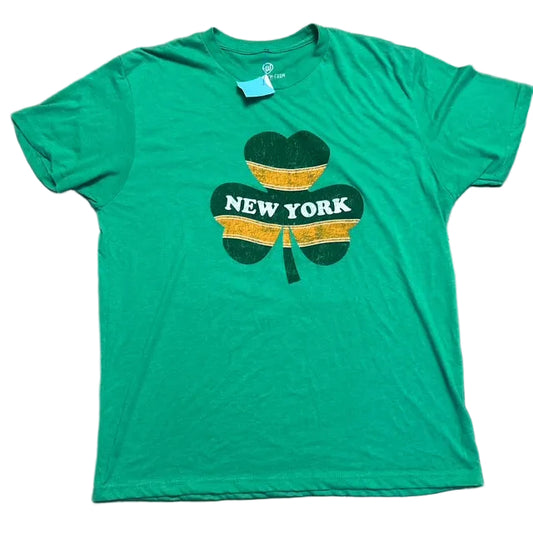 Green t-shirt with shamrock design and 'New York' text on a tiled floor