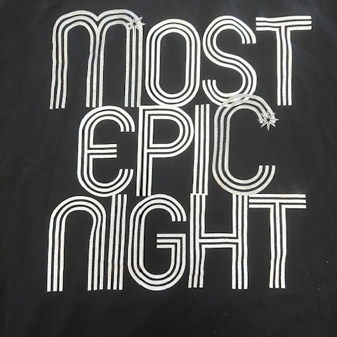 Black t-shirt with white text 'Most epic Night' on a dark background