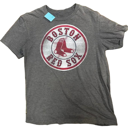 Gray t-shirt with Boston Red Sox logo on a stone surface