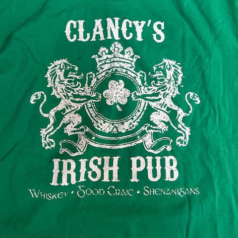 Green t-shirt with white graphic that says irish pub
