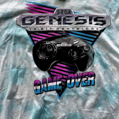 Sega Genesis cartridge with 'Game Over' text on a textured surface